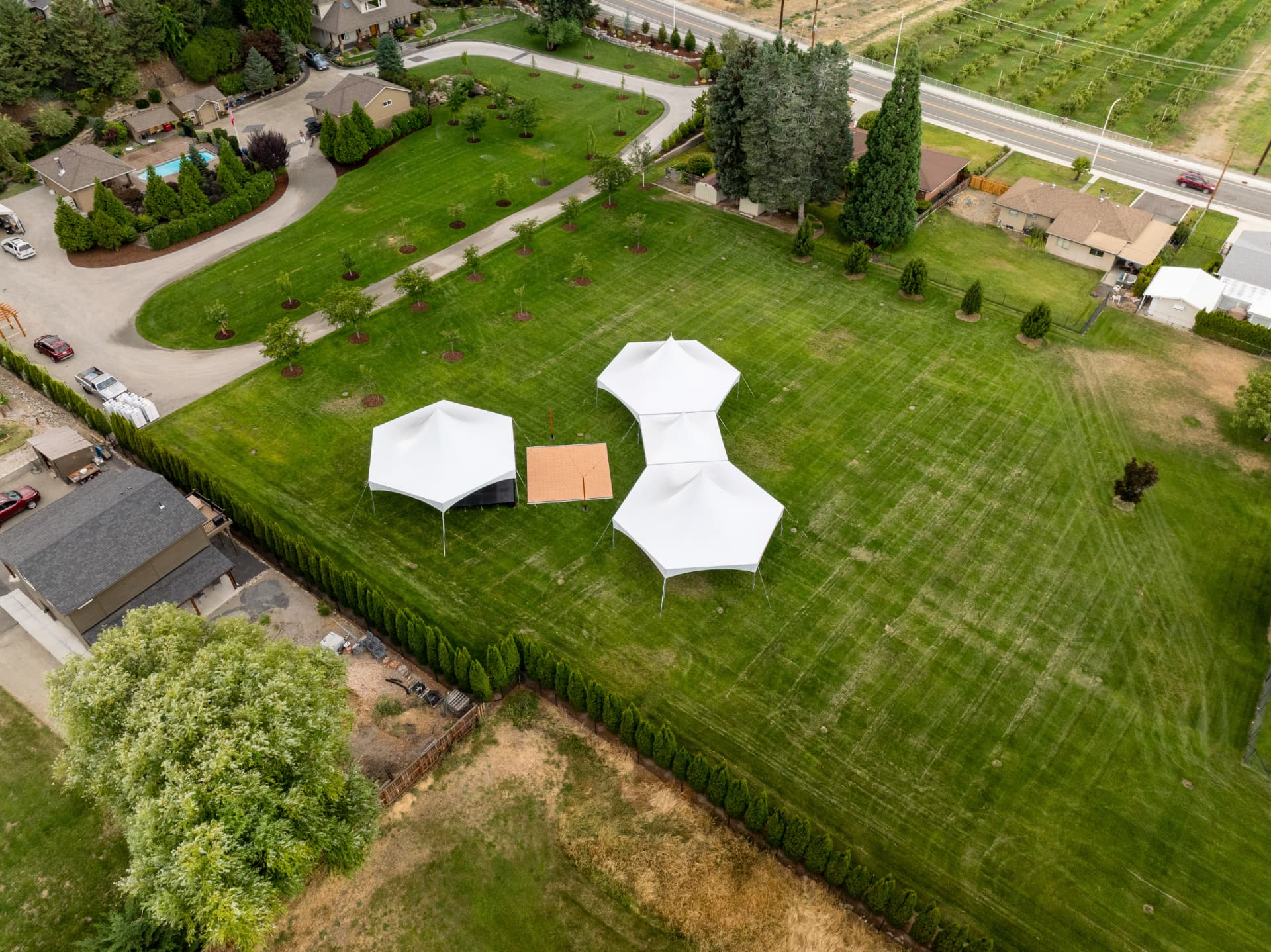 Evening tented wedding reception with string lighting rentals in Eastern Washington