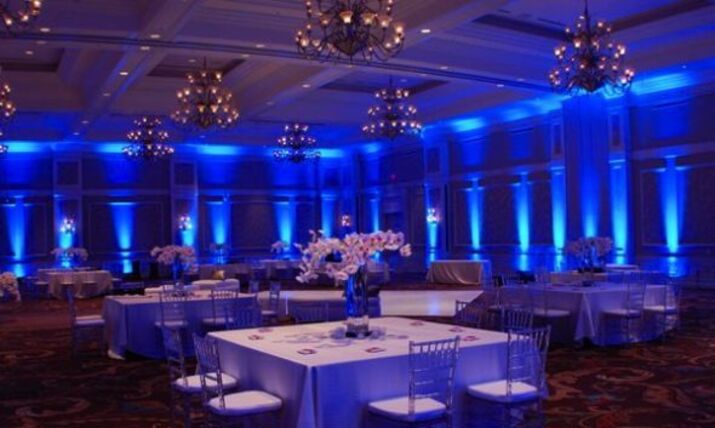 Colored uplighting washing the walls of an event space — rental item delivered across Eastern Washington by NCW Event Rentals