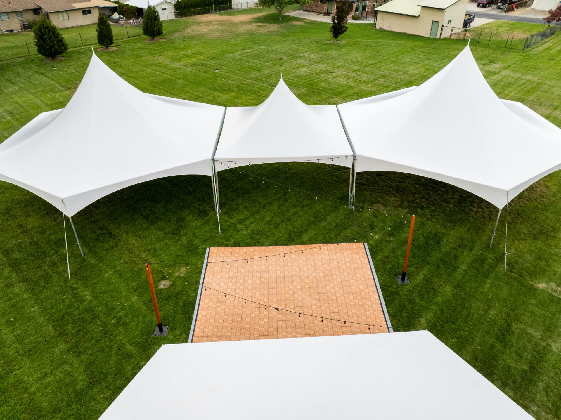 Wedding dance floor and tent rental installation in Eastern Washington
