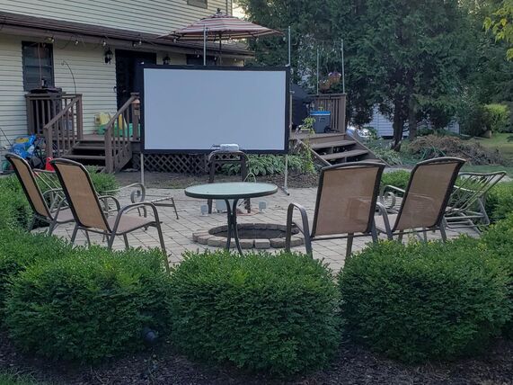 100 inch indoor outdoor projector screen on a stand — party and wedding rental in Chelan, Leavenworth and the Wenatchee Valley, Washington