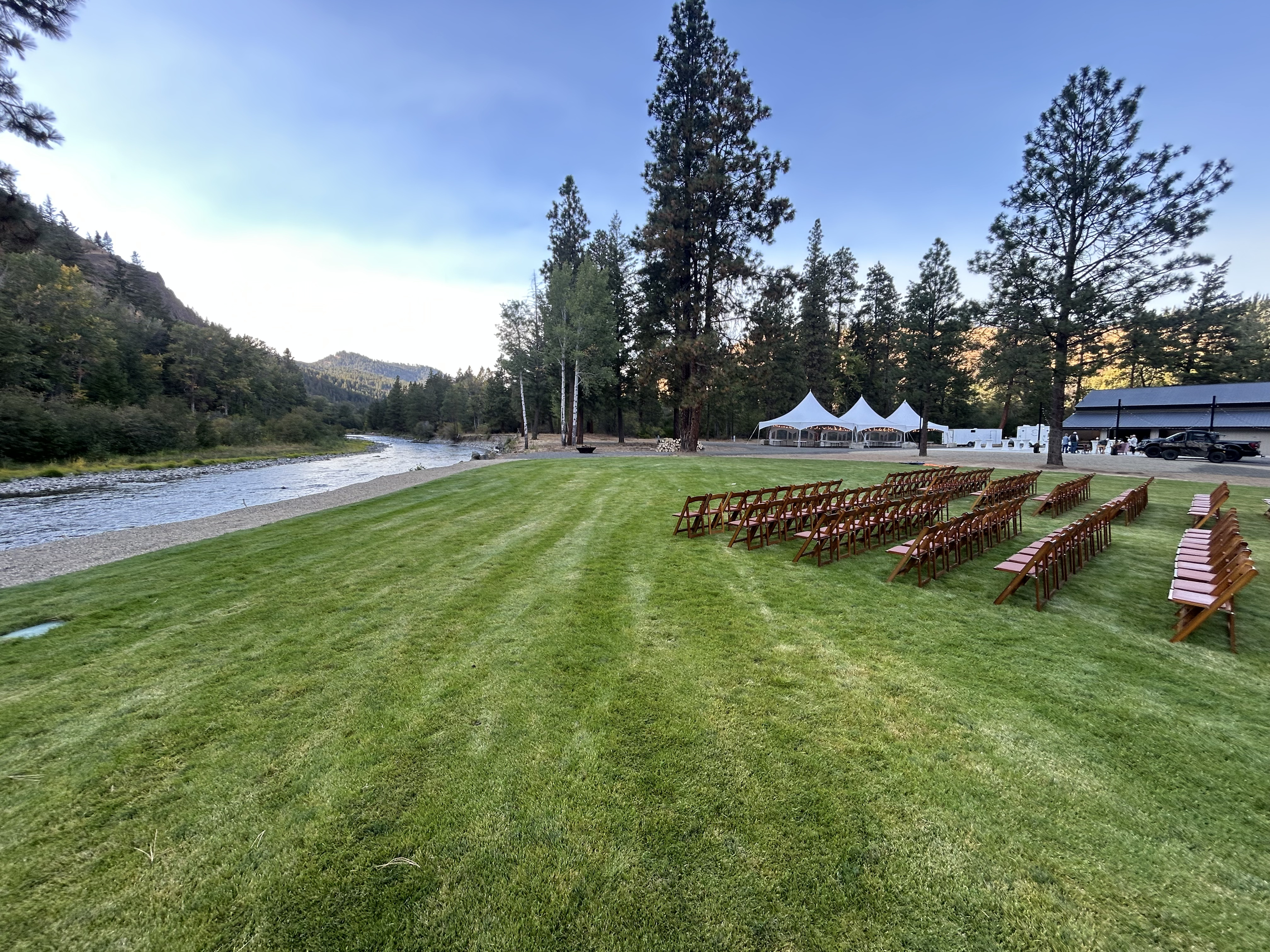 White peak tent rentals along the Yakima River for a riverside wedding in Yakima, Washington