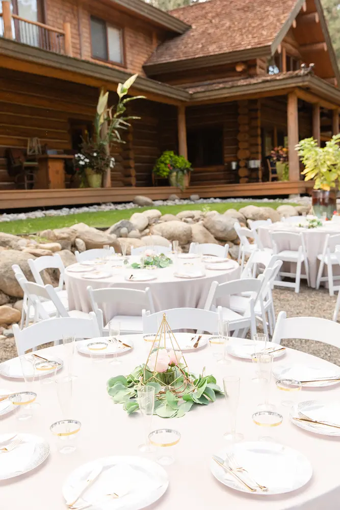 Round table rentals under a lodge veranda for a wedding reception in Washington