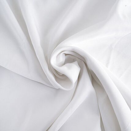 Linen Rentals delivered by NCW Event Rentals in Ephrata, Washington — White floor length round tablecloth rental